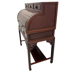 Hardwood cylinder desk, three drawers raised over curved lid, fitted interior with slide, the supports joined by undertier with fret work brackets 
