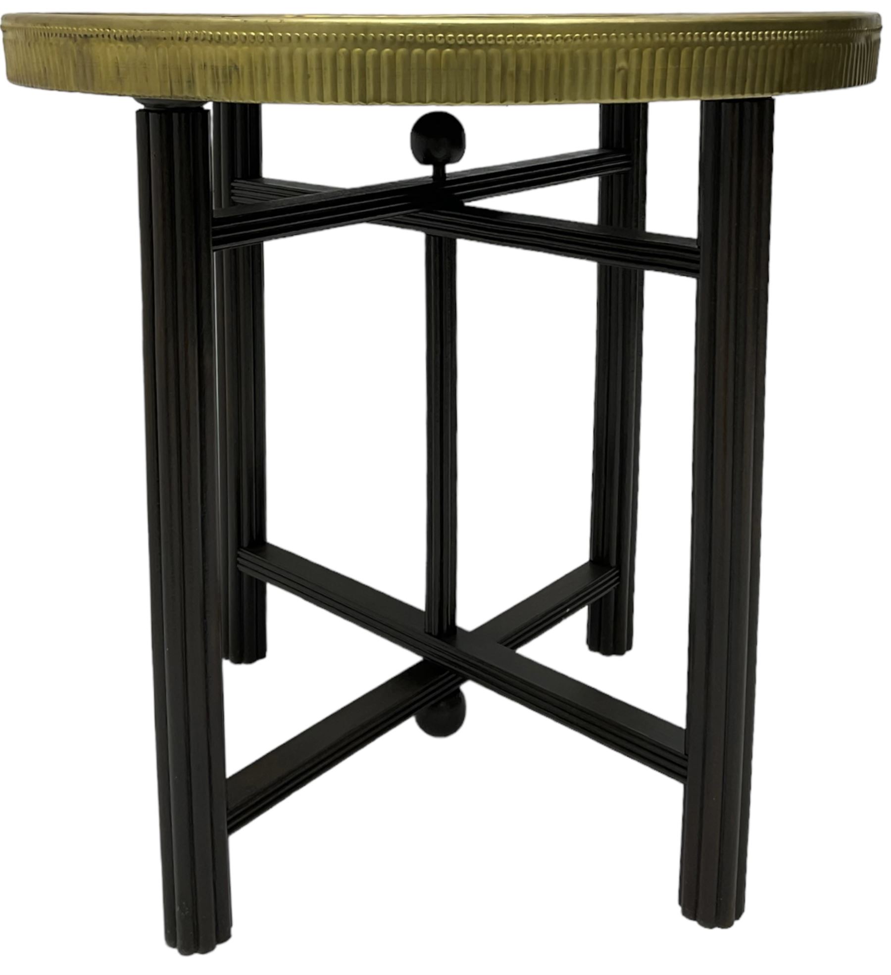 Indian brass topped folding benares table, circular top embossed with foliate and scrolling decoration, reeded supports