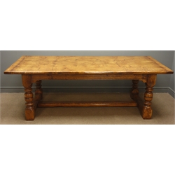  18th century style oak refectory table, cleated solid top on ring turned and block supports joined by a floor stretcher, L230cm W105cm   