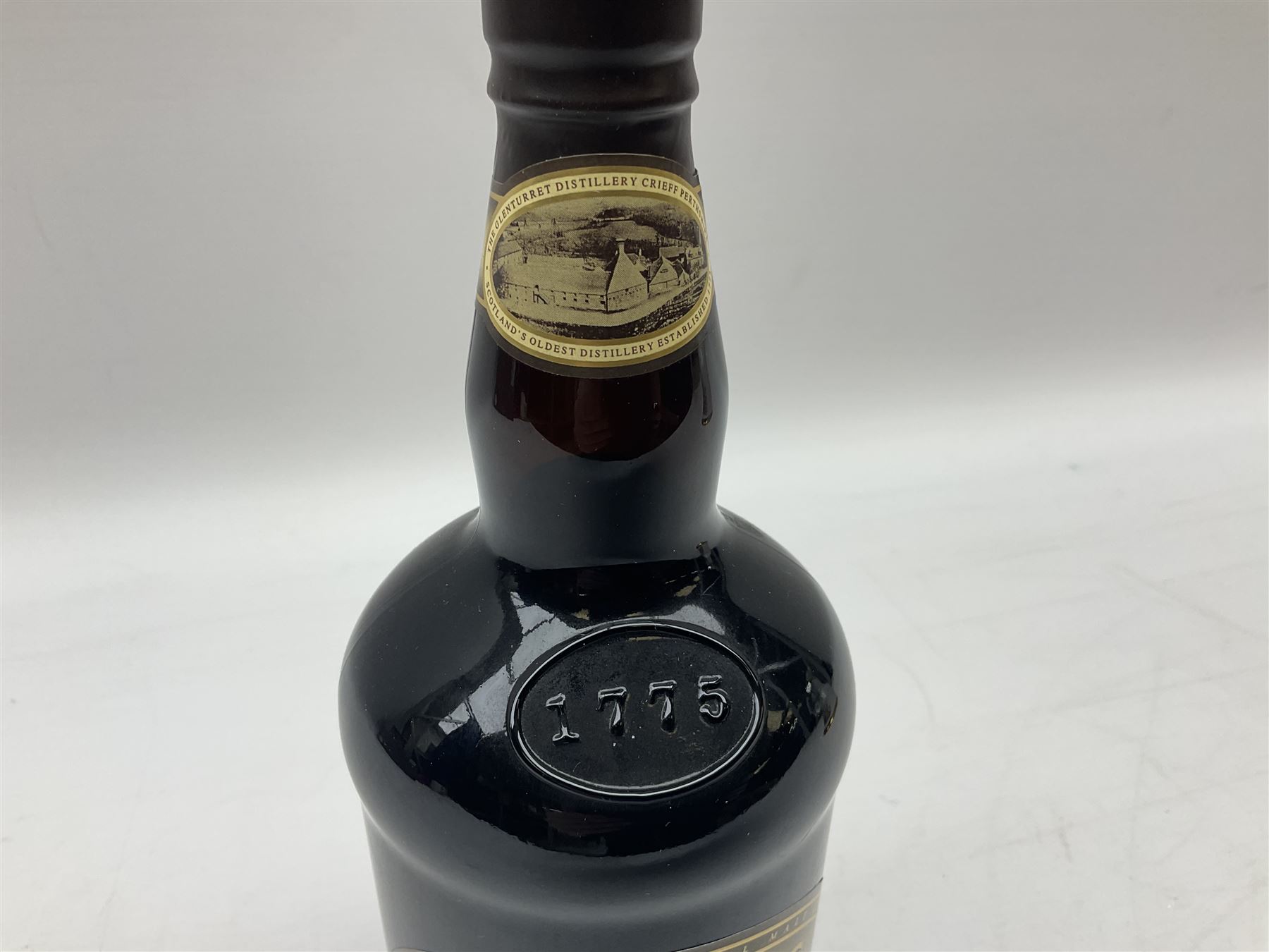 The Glenturret malt liqueur, 70cl, 35%vol and a Bell's Scotch Whisky decanter commemorating The marriage of Prince Andrew with Miss Sarah Ferguson 23rd July 1986, 75cl (2)