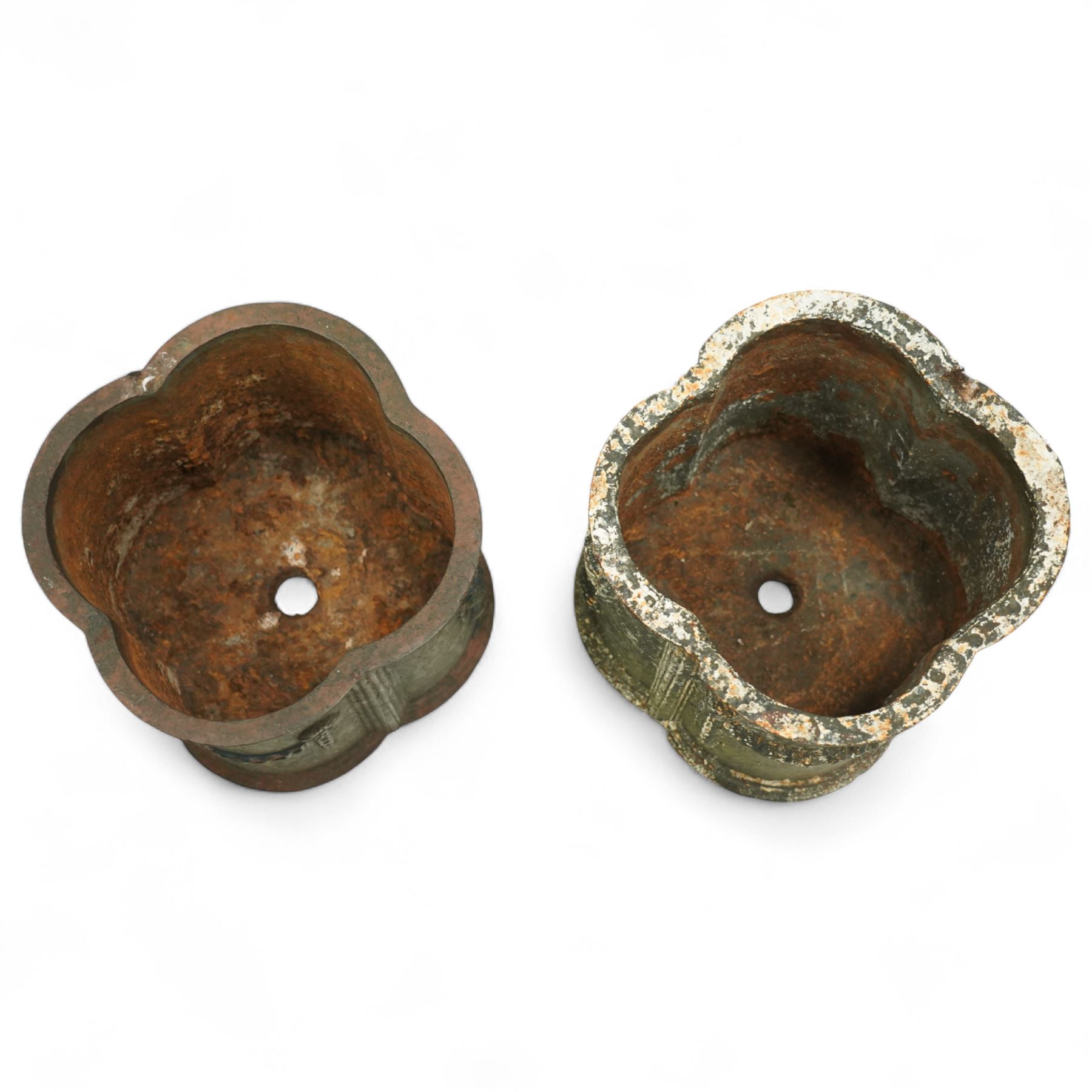 Matched pair of 20th-century cast iron neoclassical style planters, scalloped form with ornamental swag motifs in relief, one planter, probably later, 26cm wide x 22cm high, 29cm wide x 24cm high 