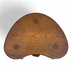 Mouseman - oak three-legged cow stool, kidney-shaped seat carved with the signature mouse motif, by the workshop of Robert Thompson, Kilburn