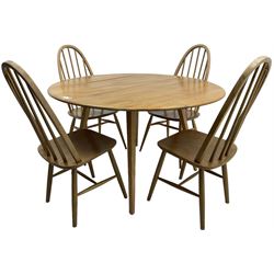 Ercol - elm and beech dining table, oval drop-leaf top on splayed square tapering supports; pair of ercol 'Windsor' elm and beech stick and hoop back dining chairs; pair of mid-20th century dining chairs 