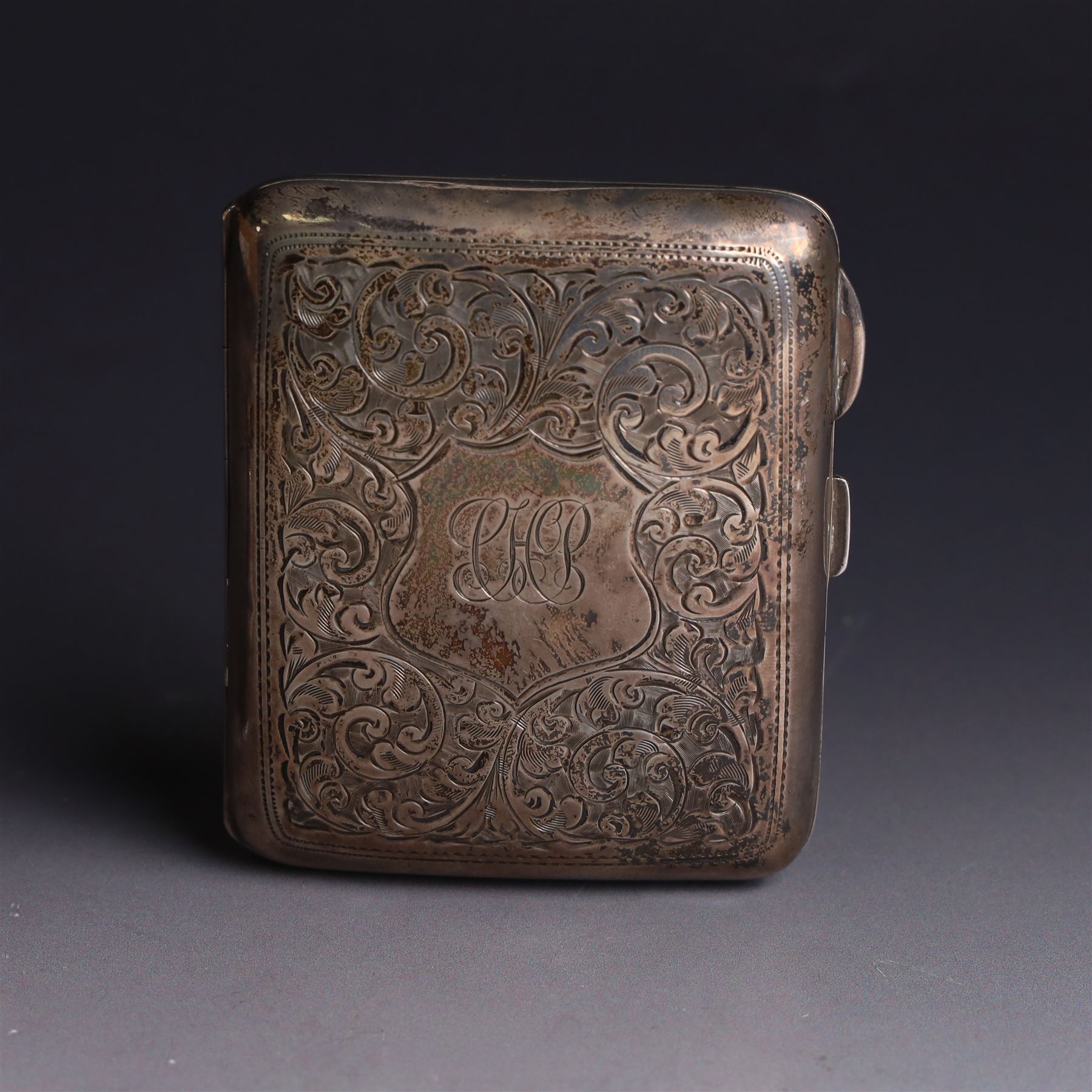 1920s silver cigarette case, with engraved initials and foliate decoration to cover and personal engraving to interior, hallmarked Smith & Bartlam, Birmingham 1924, with a similar silver vesta case, hallmarked, cigarette case H8.5cm