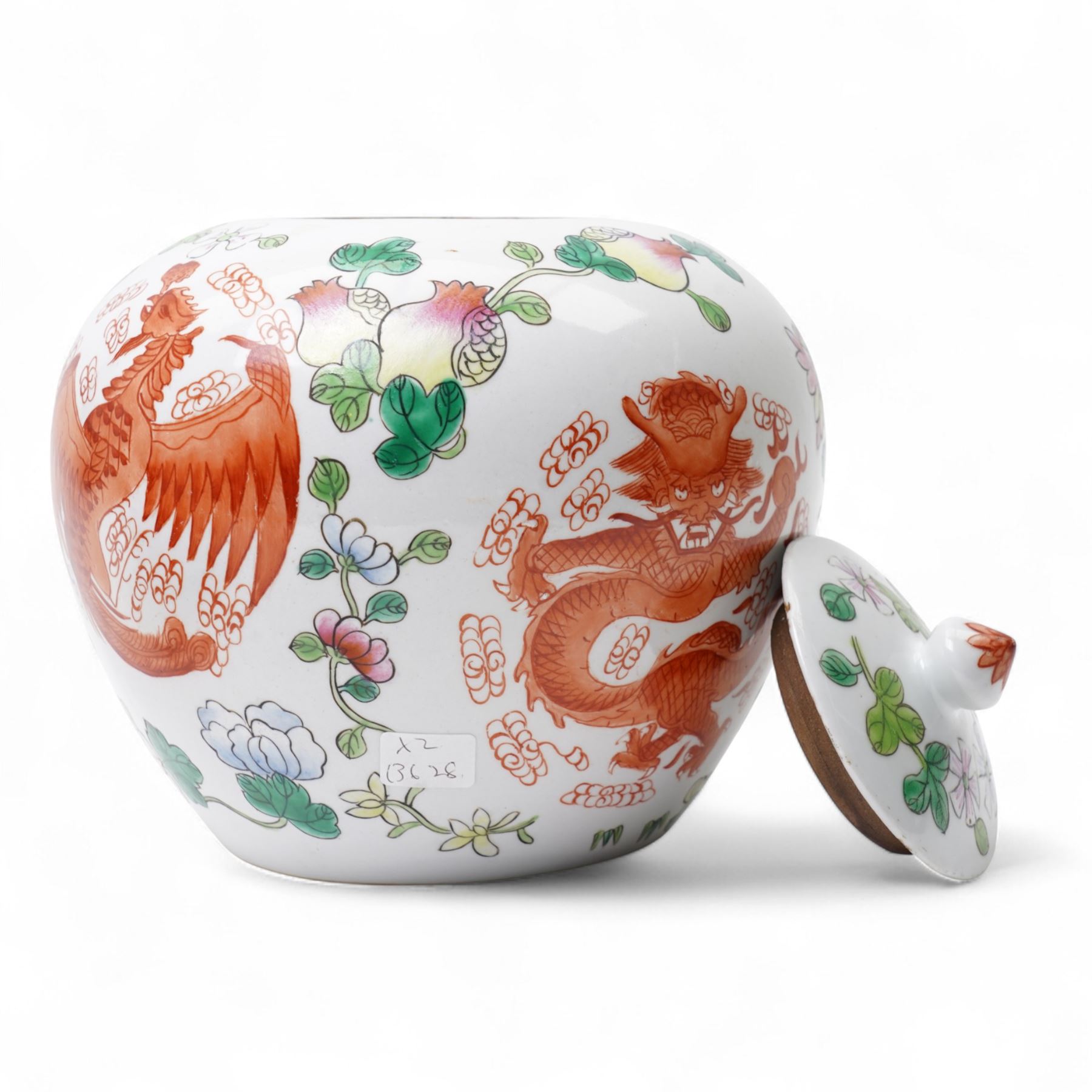 Pair of Chinese porcelain ginger jars and covers, painted with dragons and phoenix in iron red amidst flowering foliage, four character marks beneath, H20cm 
