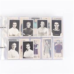 Collection of Edwardian and later Football related trading and cigarette cards, including forty-nine of fifty 1906 Ogden's Football Club Colours, 1922 PALS Footall series, ninety of one hundred 1925 Gallaher Famous Footballers, complete set of forty-four 1926 Ogden's Captains of Association Football Clubs and Colours, complete set of fifty 1927 Players Football Caricatures by MAC,  complete set of fifty 1927 Players Football Caricatures by RIP,  complete set of fifty 1930 Players Association Cup Winners, complete set of 50 1933 Ogdens AFC Nicknames etc, housed in brown cigarette card album