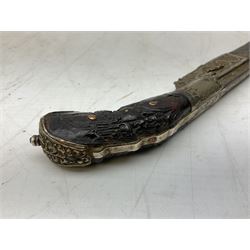 19th century Singhalese knife pia kaetta, the 20cm steel blade inset with yellow and white metal, with metal mounted carved pistol grip, in plain wooden scabbard L33cm overall