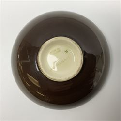 Small Moorcroft pin dish, decorated in the Hibiscus pattern with brown ground, D11cm