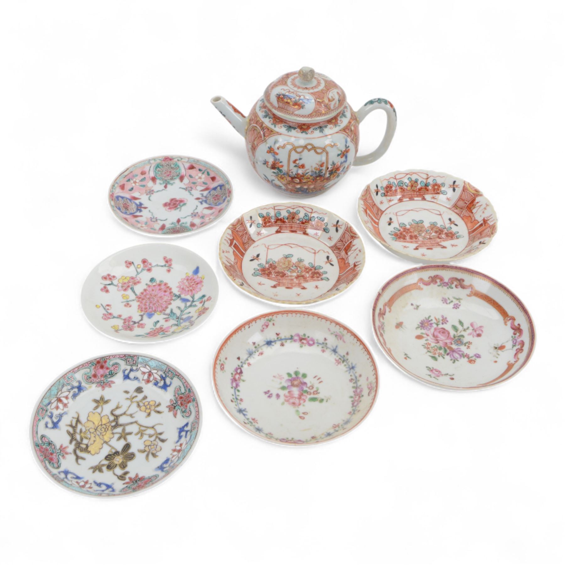 Amsterdam bont teapot, decorated with a basket of flowers, together with two Amsterdam bont saucers of similar design and five other saucers  