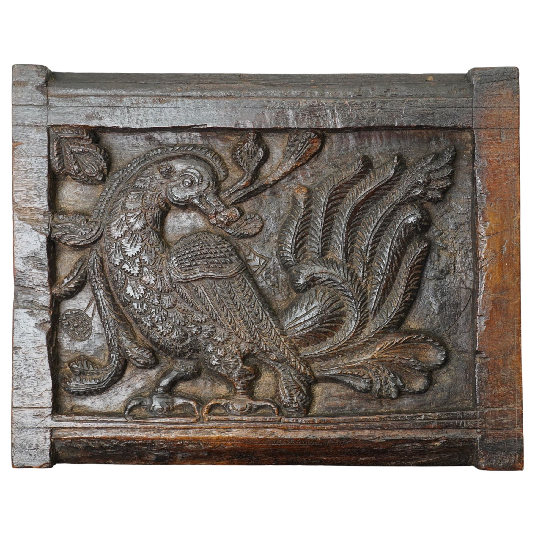 Indian teak panel with bird and floral carving, c. early 18th century, W34cm; together with four friezes with reaping carved arch decoration, each approximately W71cm (5)