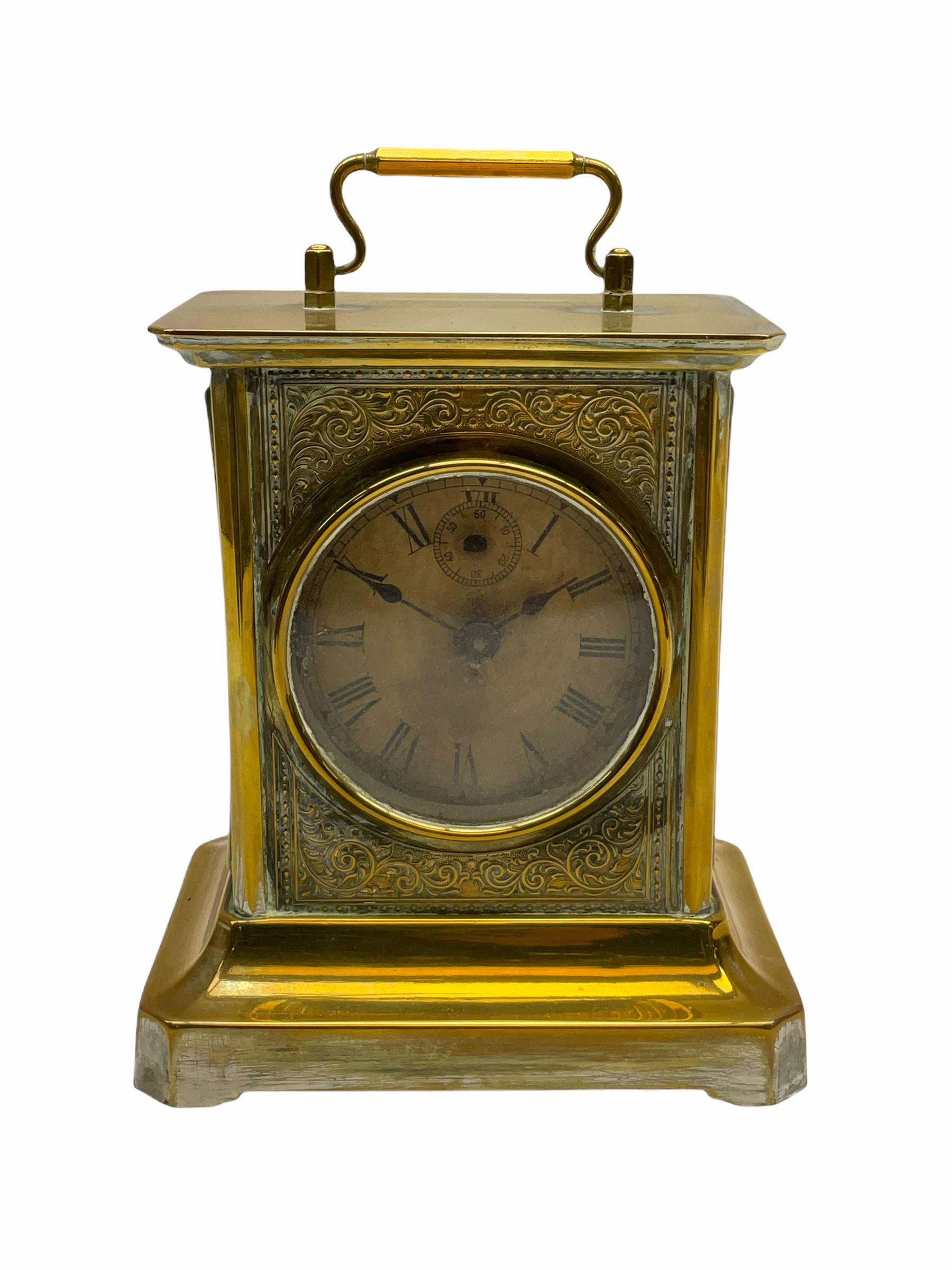 Late 19th century German Junghans “Joker “carriage clock with a musical alarm, engraved rectangular dial plate, circular card dial within an integral glazed bezel, roman numerals, minute track and alarm dial, steel spade hands, glass side panels (one missing) and rear case door, thirty-hour spring driven movement, pin pallet balance escapement, rear wound and set. 
With key.
