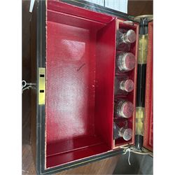  Victorian brass inlaid rosewood dressing table box, retailed by F.L. Hausburg, Liverpool, the lid centred by a brass cartouche, opening to reveal letter store to lid underside, above a fitted interior, with ten mounted cut glass jars, bottles and manicure set, within lift out leather trays, above jewellery drawer, with key, H17cm D24cm