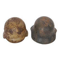 WWII German Third Reich M1940 helmet, with desert camouflage, the left inner brim stamped SE64, the back inner brim stamped 506, with leather eight tongue liner, together with German M34 helmet