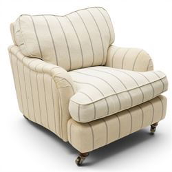 Pair of 20th century Howard shape armchairs, deep seat armchairs in cream and grep striped upholstery, raised on dark supports terminating in front castors