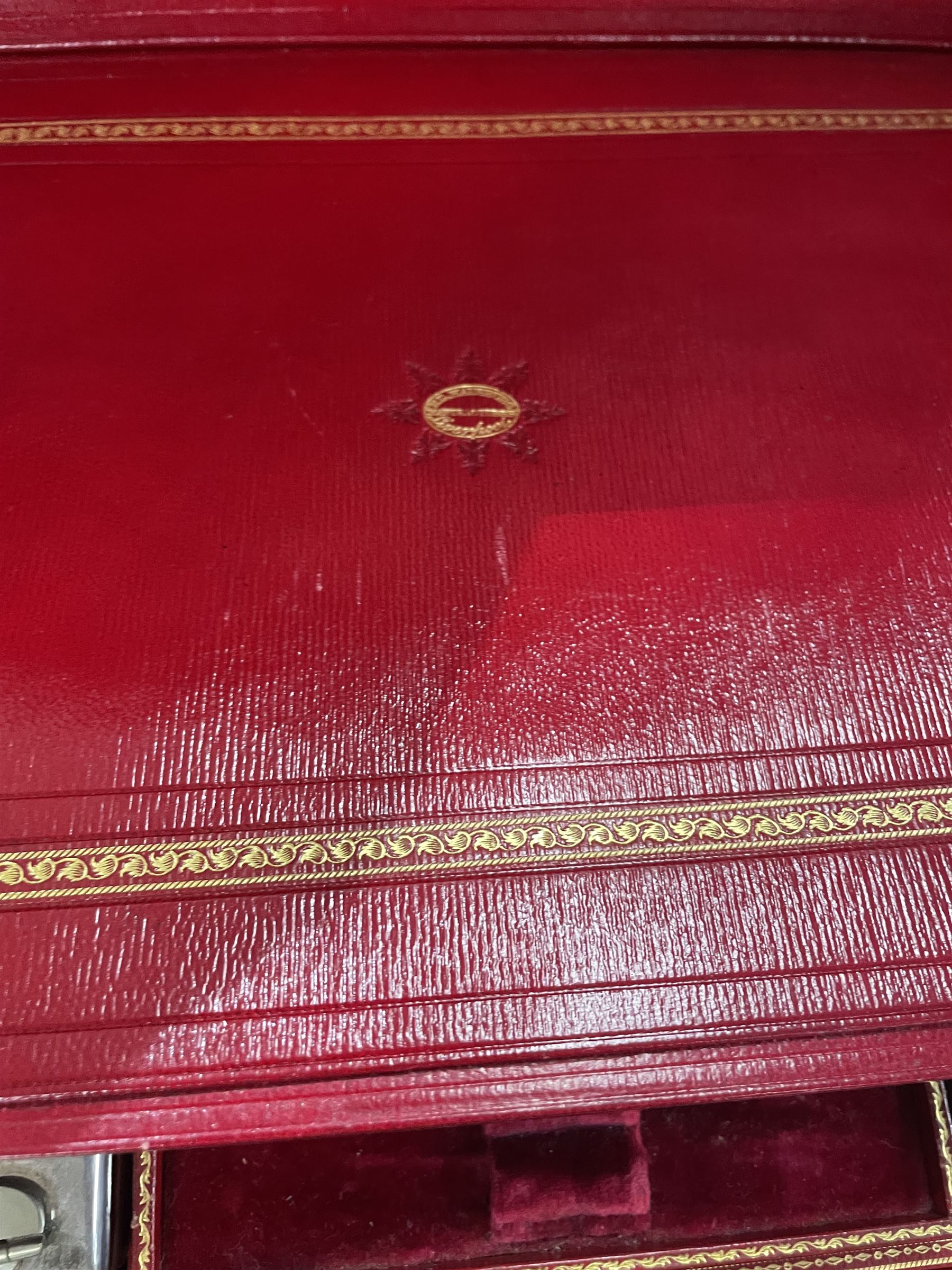  Victorian brass inlaid rosewood dressing table box, retailed by F.L. Hausburg, Liverpool, the lid centred by a brass cartouche, opening to reveal letter store to lid underside, above a fitted interior, with ten mounted cut glass jars, bottles and manicure set, within lift out leather trays, above jewellery drawer, with key, H17cm D24cm