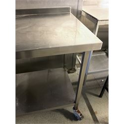 Stainless steel two tier preparation table, on castors, raised back- LOT SUBJECT TO VAT ON THE HAMMER PRICE - To be collected by appointment from The Ambassador Hotel, 36-38 Esplanade, Scarborough YO11 2AY. ALL GOODS MUST BE REMOVED BY WEDNESDAY 15TH JUNE.