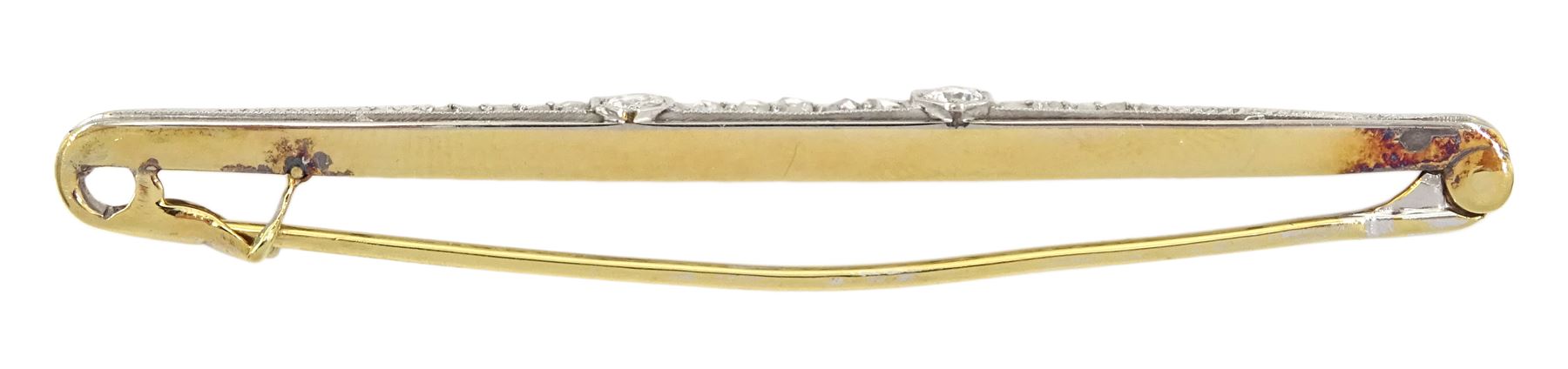 Early 20th century diamond set marquise shaped brooch, two round cut diamonds with rose cut cut diamonds set between