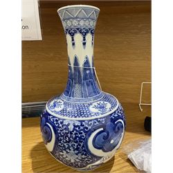 Late Qing Dynasty bottle vase decorated in blue and white with dragons and pearls, stylised leaves and flowers with key pattern foot H40cm 