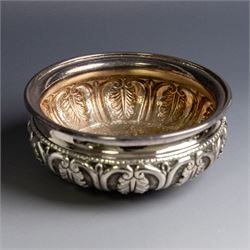 Indian silver bowl, of circular form with embossed acanthus leaf decoration, upon three bun feet, D5.5cm, H13cm