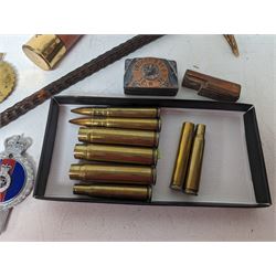 Walking stick with carved monkey handle, glass shooting flask in the form of a cartridge, bullet casings and other collectables