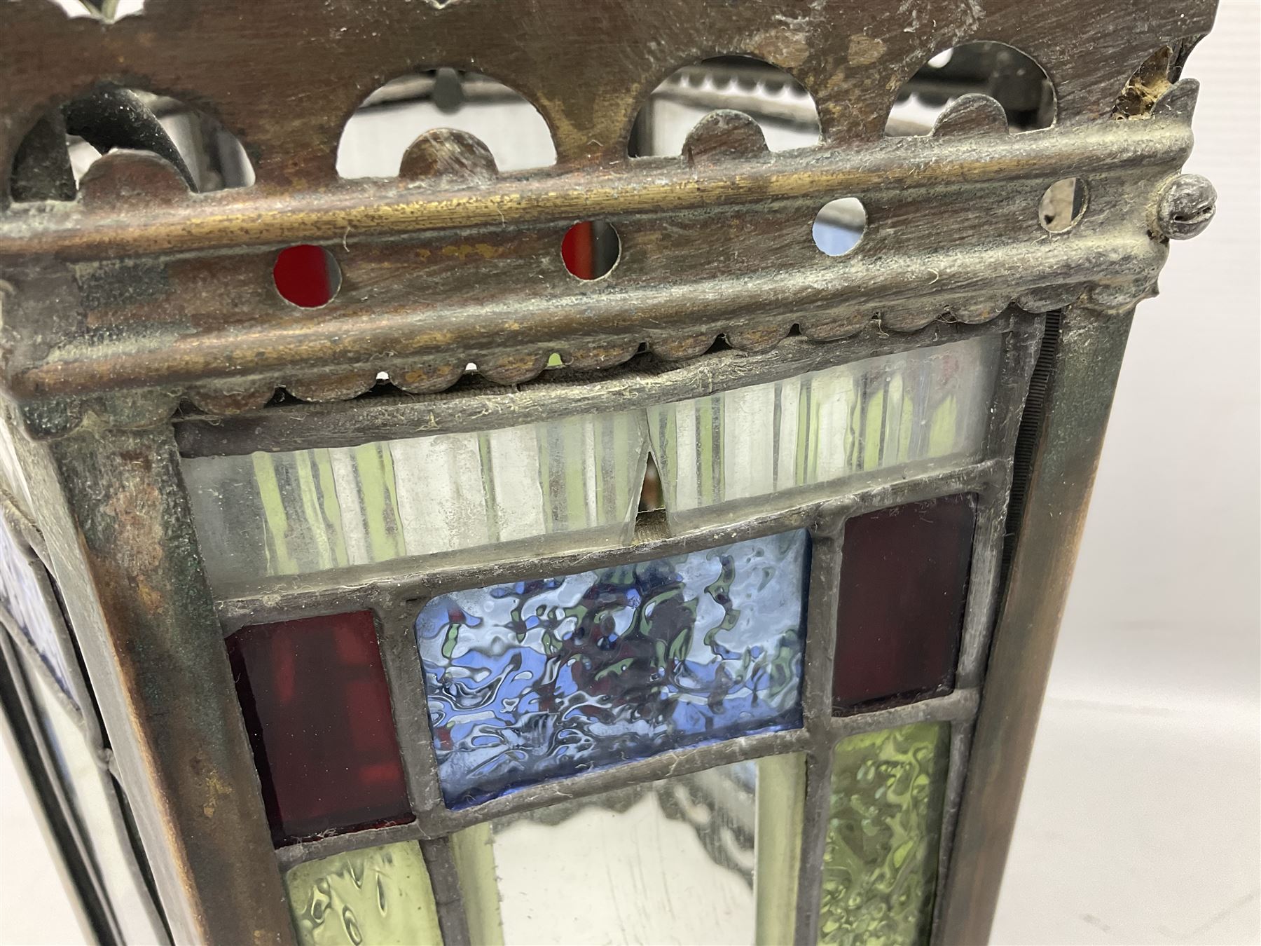 Victorian brass and stained leaded glass hall lantern, of hexagonal form, supported by four domed arms and pierced fret, H46cm W20cm