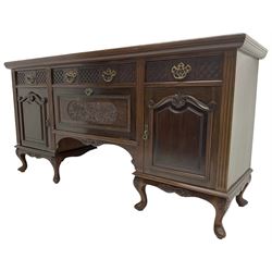 Late Victorian walnut sideboard, moulded rectangular top over three drawers  with blind fretwork facias, fitted with central fall front cupboard with extending foliage carved decoration and two flanking panelled cupboards, on acanthus carved cabriole feet