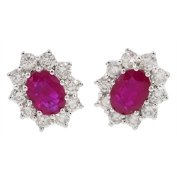  Pair of 18ct white gold ruby and diamond cluster stud earrings, total ruby weight 1.9 carat, total diamond weight 1 carat  
