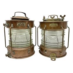 Two Ships copper anchor lamps by Meteorite, each with a brass plaque marked with makers name and serial number, and ribbed clear glass shades, H36cm