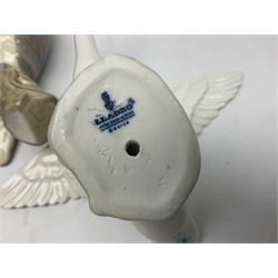 Lladro figures of animals, comprising Mini Lion no 5436, Beautiful Burro no 5683, Hawk Owl no 5422, Beagle Puppy Sitting no 1071, Duck Flying no 1264, Miniature Cat no 5308 and Small Papillon Dog no 4749, four with original boxes, largest example H14cm