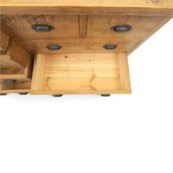 Indigo Furniture - large rustic oak combination chest sideboard, fourteen drawer with blackened metal cup handles, on a plinth base