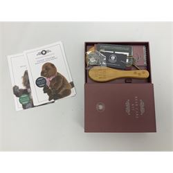 Five Charlie Bears Plush Hug Book Collection books, comprising Guide To Snuggleability containing Snuggleability CB191971F, Paw-Some Facts Directory containing Pawsome CB191971D, Bear Therapy Handbook containing Bear Therapy CB191971E, Study Buddy Handbook containing Study Buddy CB191971A, and Guide to Being Bear-illiant CB191971B, each designed by Isabelle Lee, each with tags, plus Charlie Bears Secret Hug Book (lacking contents), together with assorted Charlie Bear accessories, to include two Bear Ears Duffle headbands CBBEARSDUF, Egg Cup CB185198 , Incy Wincy CB205252AO, with tag, four key rings, all with tags, Bear Care Kit and contents, recipe cards, pin badges, tape measure, notebook, etc., (Qty)