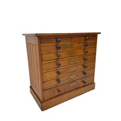 Late 19th century pitch pine multi-drawer chest or collectors cabinet, fitted with nine slides, on plinth base