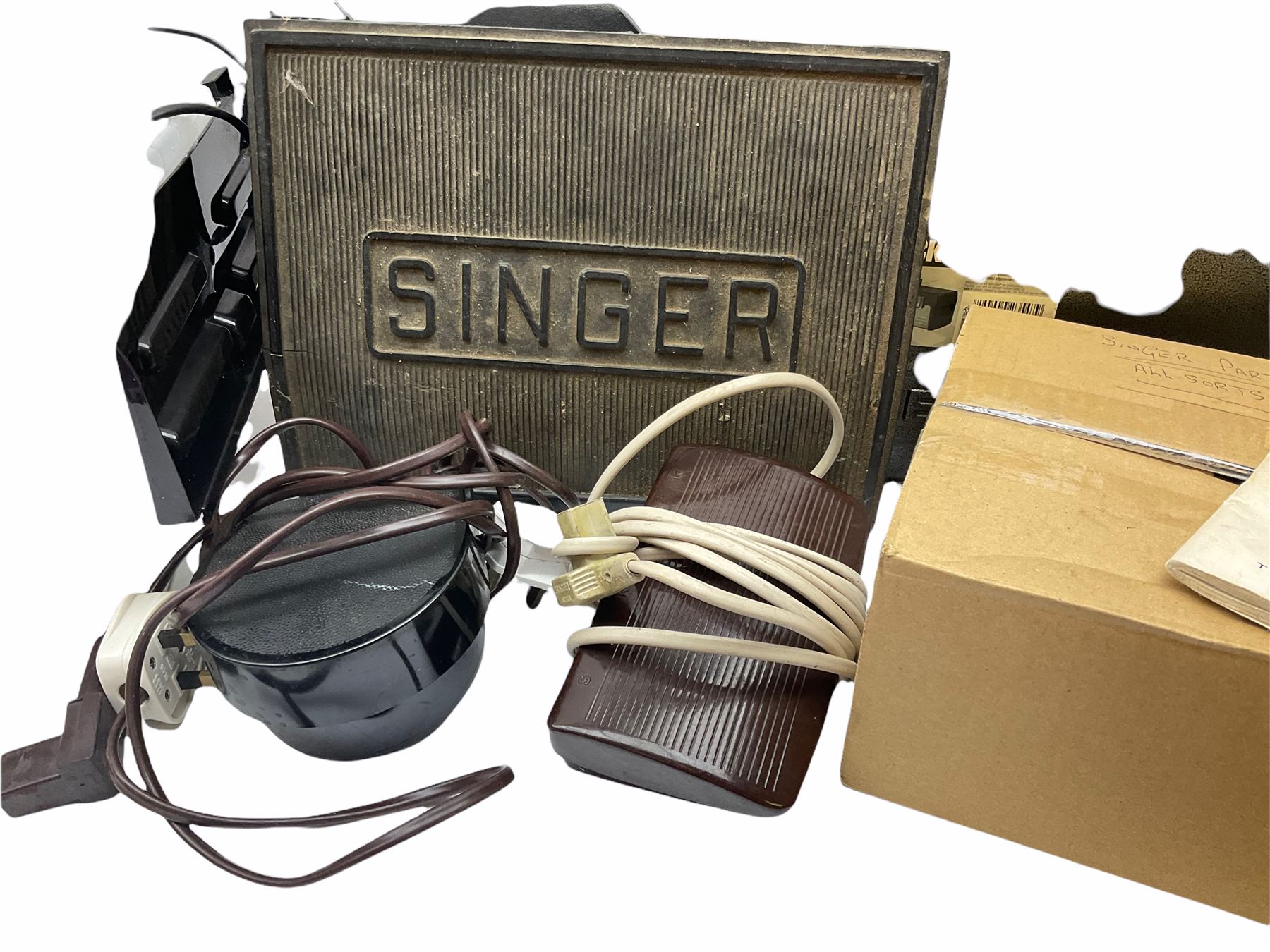 Two Singer sewing machines, model numbers 527 and 457, together with various Singer sewing machine parts, and a selection of sewing related accessories, to include threads, sewing needles, etc. 