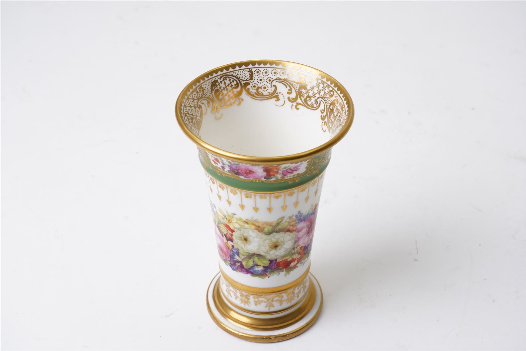 Brown-Westhead, Moore & Co cabinet cup and saucer, with rope twist moulded handle, hand-painted with floral reserves against a white and sky blue ground, heightened profusely with gilt, together with a pink hand-painted example, and a 19th century spill vase and twin-handled covered sucrier (4)
