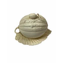 20th century Leeds creamware, comprising chestnut basket and stand, small tureen and cover, ladle, and associated stand, candlestick with stem modelled as a dolphin, teapot, tureen and cover in the form of a melon with fixed stand, and toast rack (toast rack a/f), each with impressed mark beneath. 