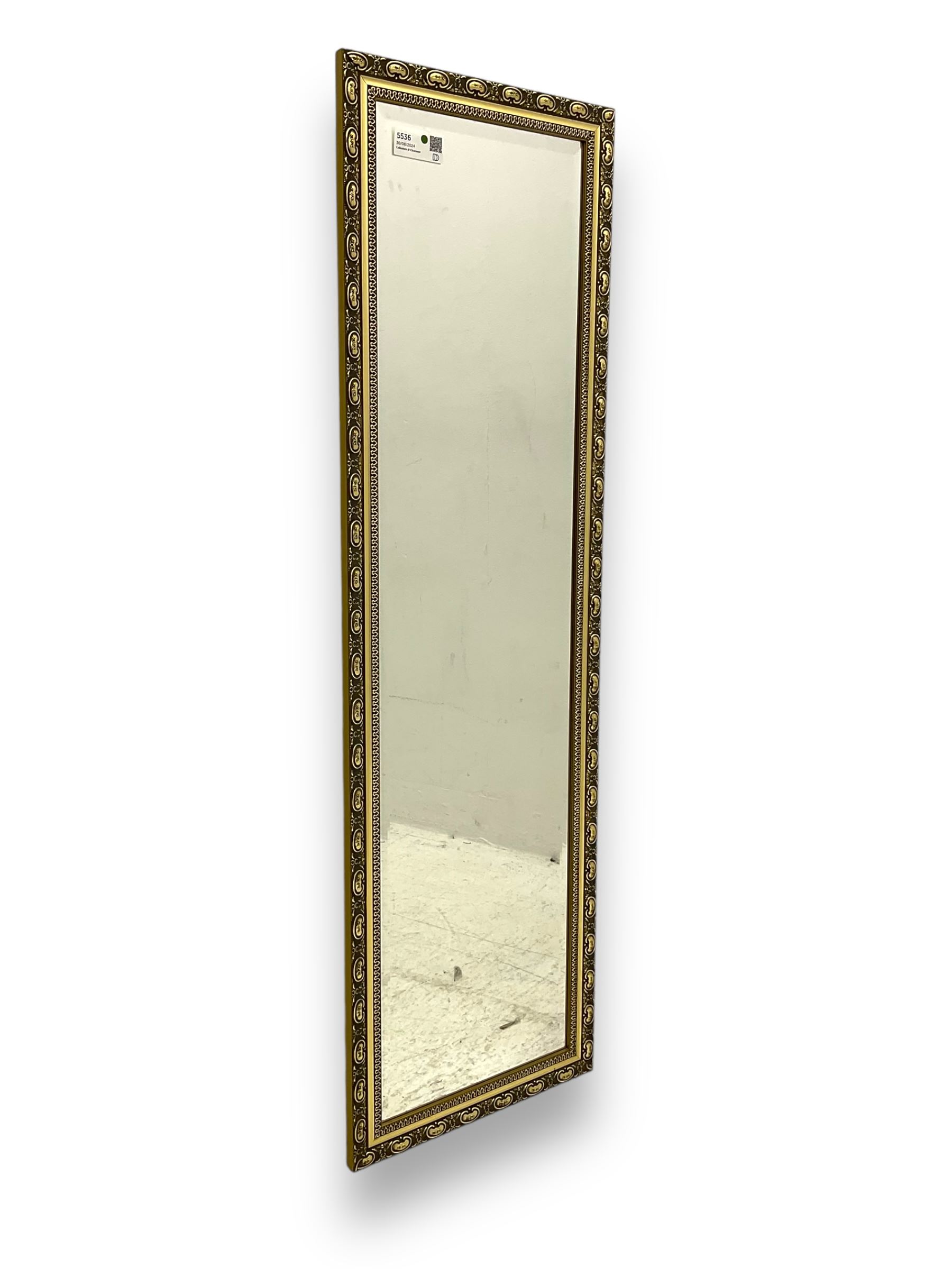 Gilt framed wall mirror, rectangular bevelled mirror plate enclosed by gilt-edged border with continuous wave pattern, outer border with oval medallions and foliate designs