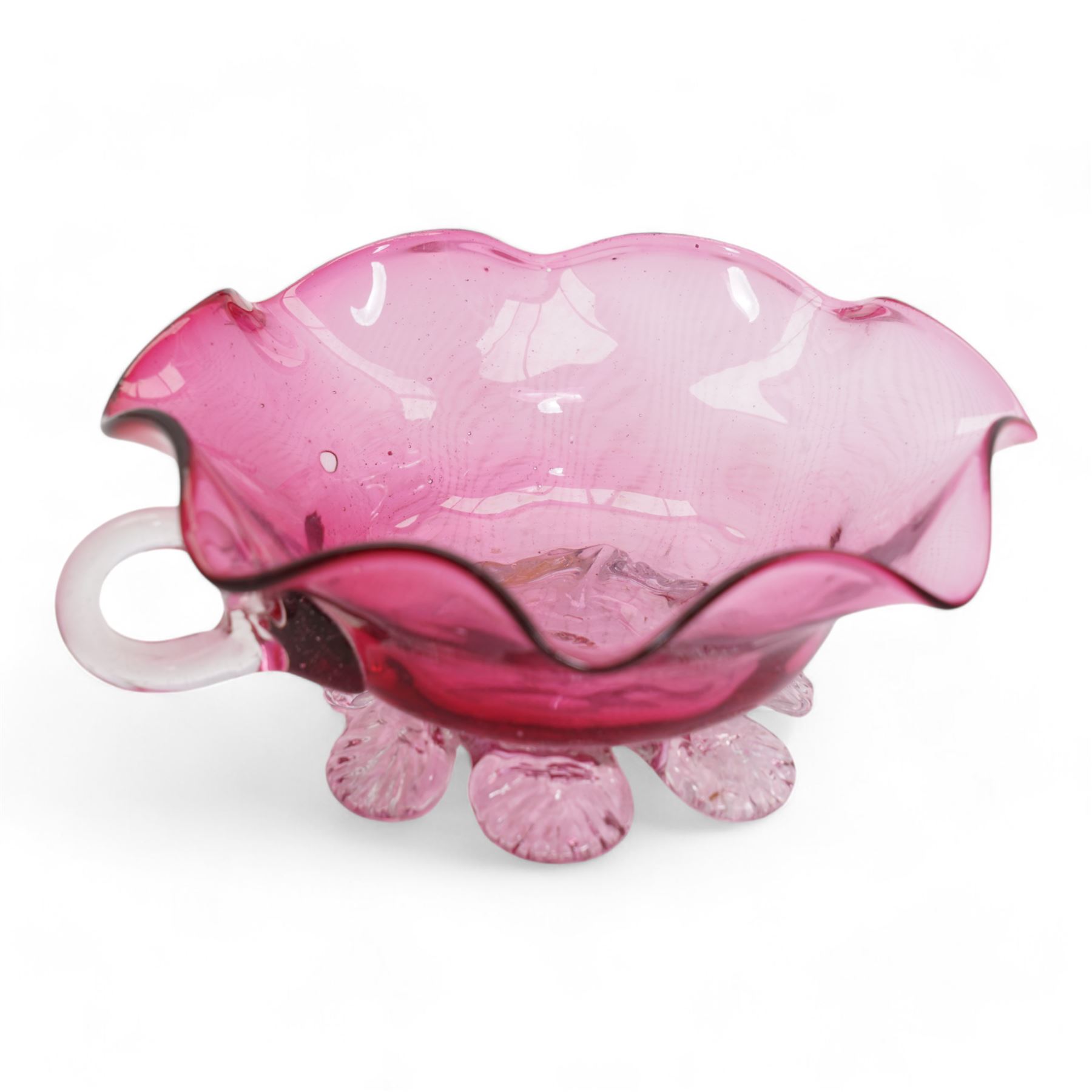 Early 20th century Bohemian cranberry glass flower form plate, overlaid with opaque and hand painted and gilded with a floral bouquet, D19.5cm, pair of cranberry glass pulpit vases, satin glass ewer and two further pieces of cranberry glass (6)