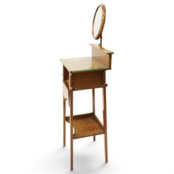 Early 20th century oak valet stand, raised back withy circular swivel mirror, over fall front compartment, raised on square supports united by concave under-tier