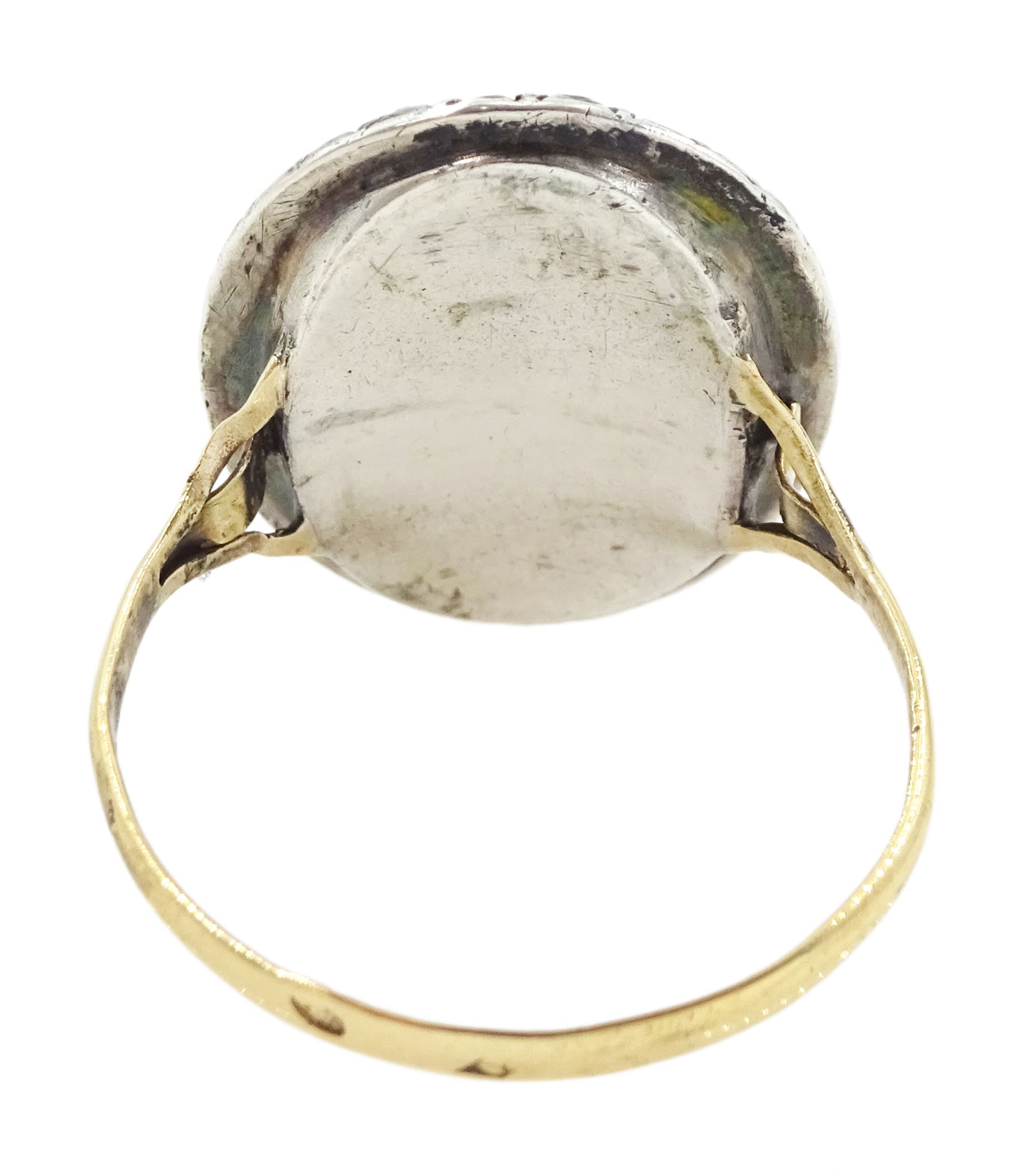 19th century French 18ct gold and silver marcasite portrait ring, set with an oval miniature of a woman on ivory, under glazed panel, with marcasite surround and trifurcated shoulders, hallmarked. This lot has been registered for sale under Section 10 of the APHA Ivory Act
