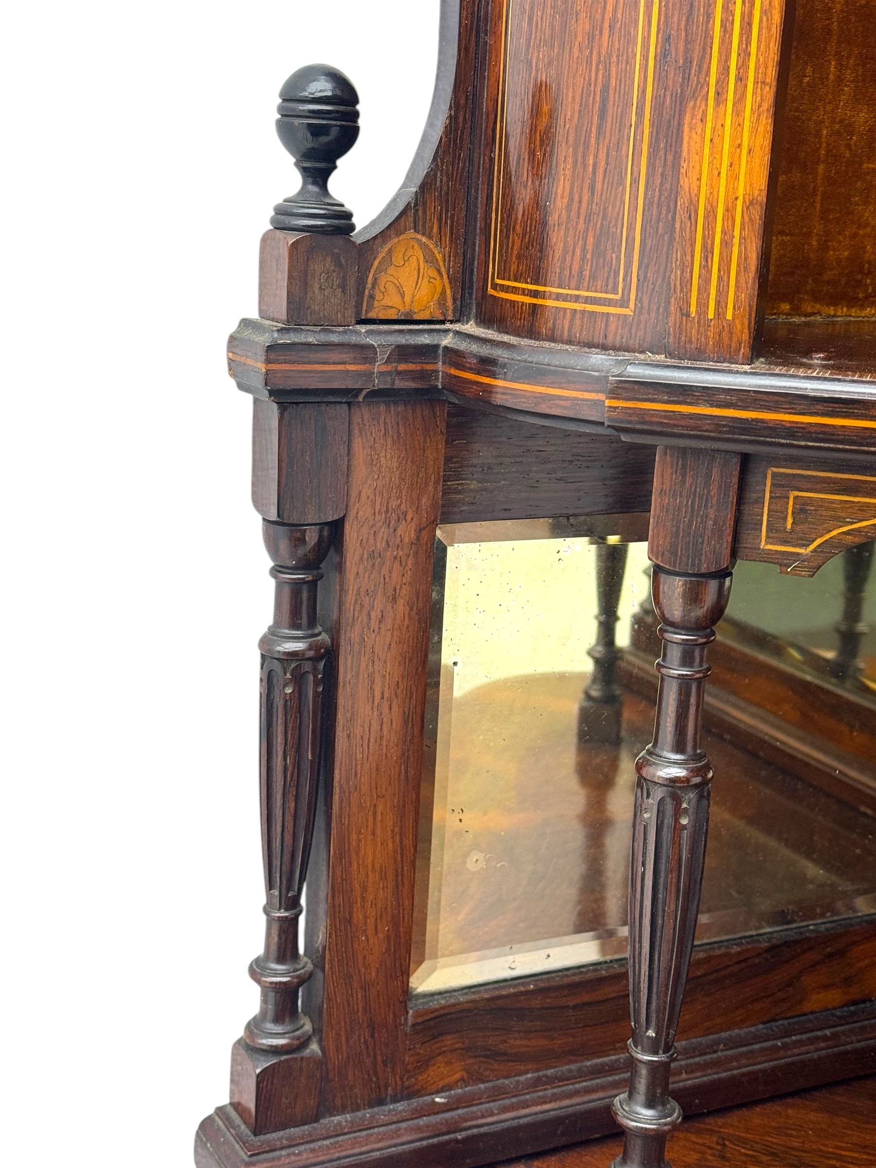 Late 19th century inlaid rosewood free standing corner display cabinet, the upper section featuring a mirrored panel above an inlaid cupboard with a felt-lined interior, complemented by a recessed open compartment with a mirrored back, the base with a glazed door enclosing two felt-lined shelves, on turned supports