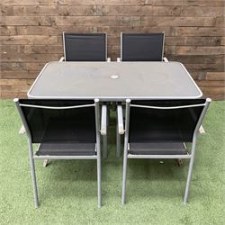 Rectangular metal framed garden table with glass top and four stackable chairs - THIS LOT IS TO BE COLLECTED BY APPOINTMENT FROM DUGGLEBY STORAGE, GREAT HILL, EASTFIELD, SCARBOROUGH, YO11 3TX