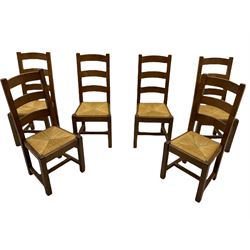 Antix French oak dining table with two leaves, two frieze drawers;, and six ladder back chairs with rush seats