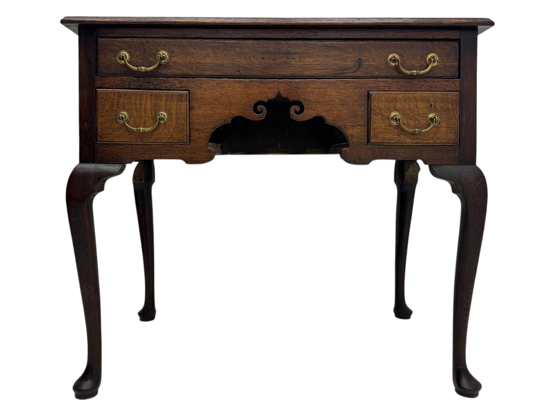 George II oak lowboy, moulded rectangular top over one long and two short drawers fitted with brass drop handles, shaped apron with scrollwork carvings, raised on cabriole supports