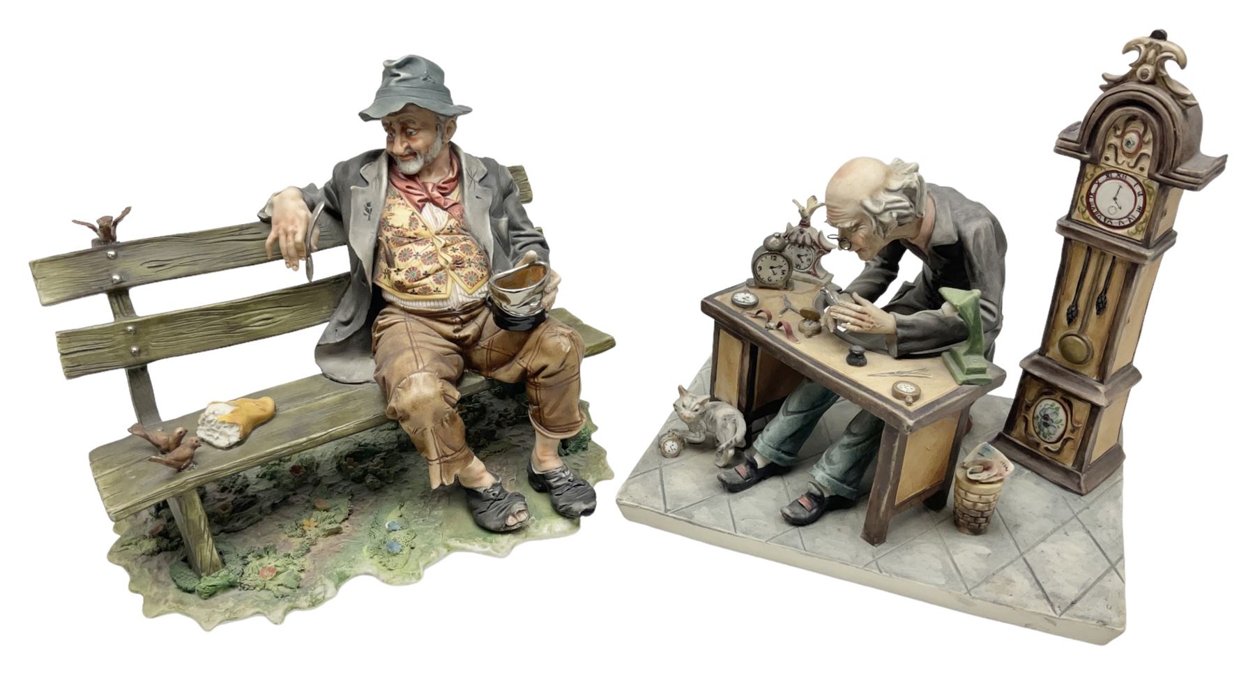 Two Capodimonte figures, comprising The Watchmaker by Curiase and Tramp Seated on a Bench, created by D.Bonalberti, tallest example H24cm