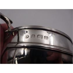 Early 20th century silver milk jug and sugar bowl, of circular form, with reeded girdle and capped scroll handles, each upon four pad feet, hallmarked William Aitken, Birmingham 191, H8.2cm
