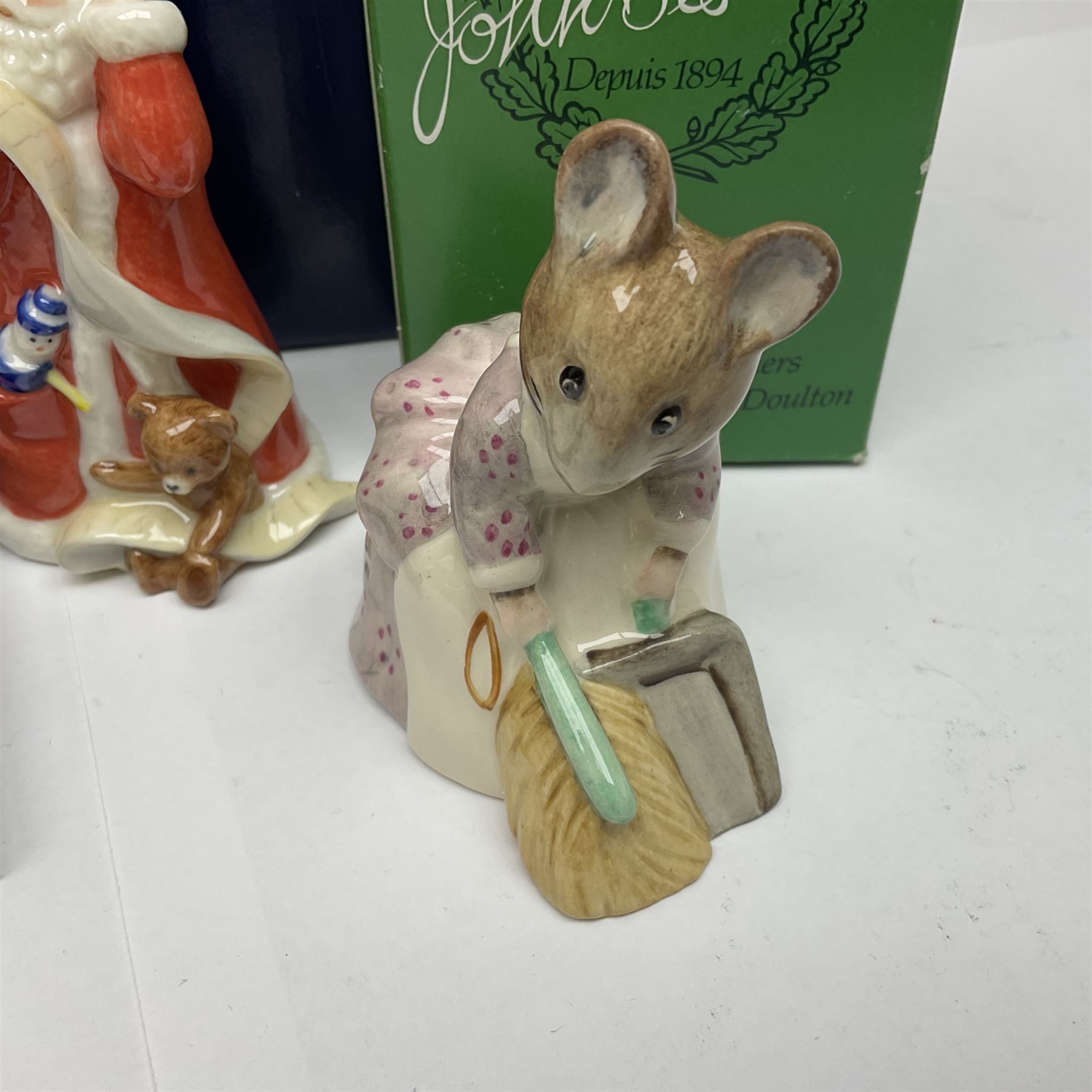 Two Royal Copenhagen figures, comprising Julie and Girl with Saw, together with Beswick Hunca Munca Sweeping, and two Villeroy & Boch christmas decorations, all with original boxes   