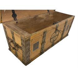19th century painted oak sea chest, hinged dome top enclosing small compartment, bound by shaped and pressed metal strapwork, scumbled finish to resemble oak and painted with small vignettes depicting portraits and landscapes within panels, fitted with large wrought metal carrying handles, the front inscribed 'H.J.S. 1870' 