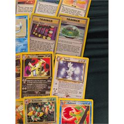 Collection of Pokemon TGC trading cards, including two WB First Movie Black Star promo cards Pikachu no. 4 and Dragonite no. 5, two Ancient Mew Black Star holo promo cards, Gym Challenge Giovanni's Persian 8/132 holo and a small collection WOTC, Neo Discovery and Neo Genesis cards, together with thirty four Bandai Carddass Pokemon cards, including prism Charizard no. 186 and Pokemon Topps cards including holo examples 