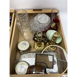 Assorted collectables, to include small quantity of glassware, pair of brass candlesticks, part dressing table set, selection of silver plated flatware, etc., in two boxes 