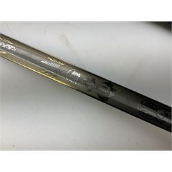 WW1 George V era 1827 Pattern Royal Naval Officer’s sword, the 80cm fullered steel blade decorated with crown, fouled anchor etc and marked Gieves Portsmouth London Edinburgh Devonport to the ricasso, gilded hilt with fouled anchor and crown, wire-bound ray skin grip, lion’s head pommel with mane backstrap, folding/locking langet and full bullion knot; in  leather scabbard having twin brass lockets with hand engraved panels and twin suspension rings L94cm overall. Provenance: By direct family descent from Brian Heathcote HMS Conqueror later Superintendant in the Liverpool Special Constabulary.